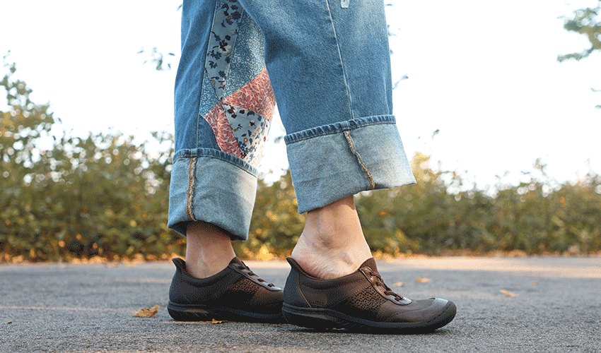 Woman stepping into hands free Jambu Veronica Touchless sneaker