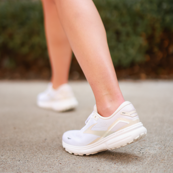Woman standing on sidewalk