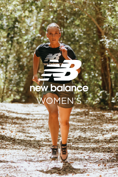 Woman running through shaded trail area