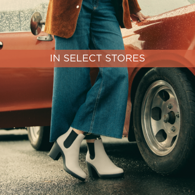 Woman leaning against car