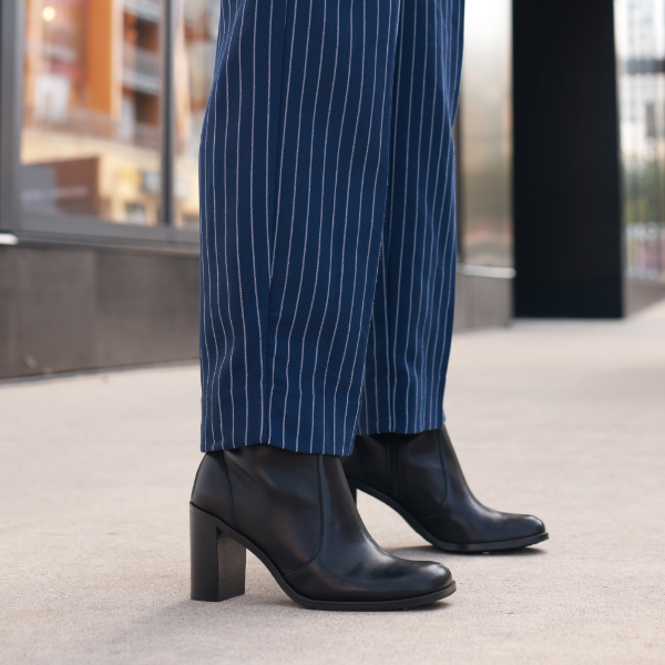 Woman standing on sidewalk
