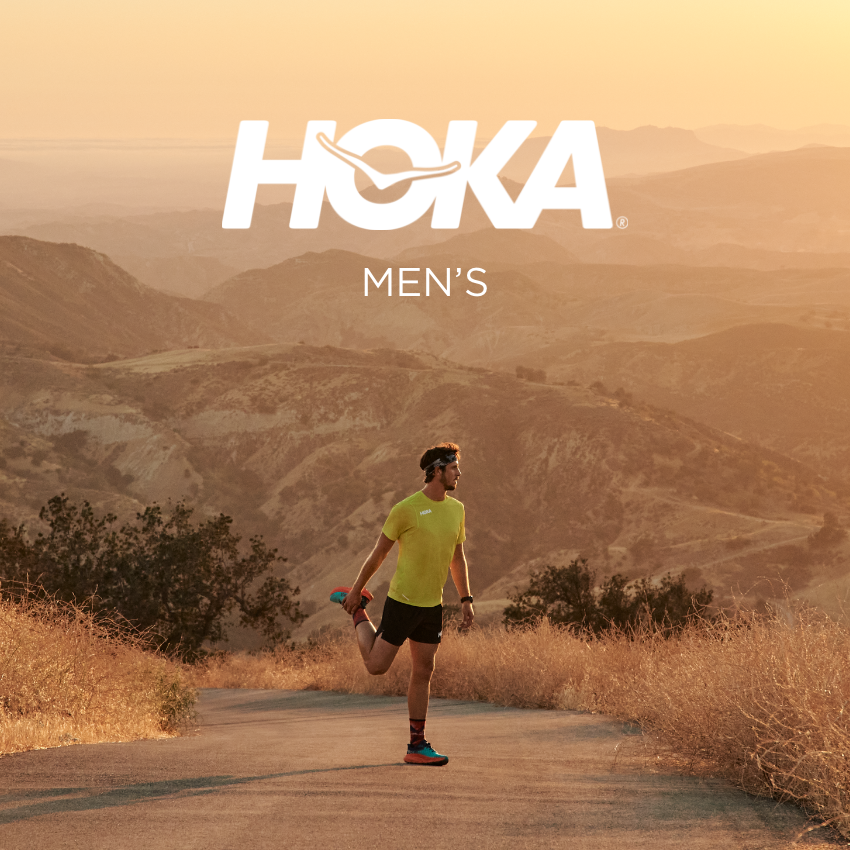 Man stretching for run in middle of dirt road