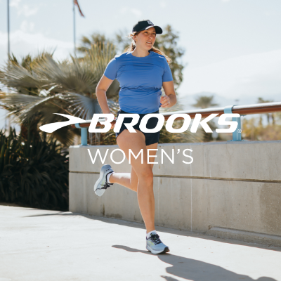 Woman running across bridge