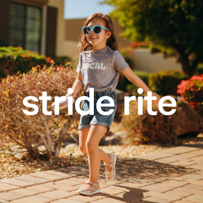 Girl walking on sidewalk 