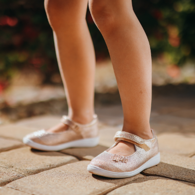 Girl standing on sidewalk