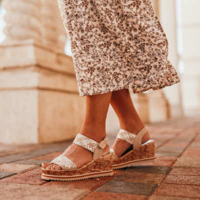 Woman standing on sidewalk