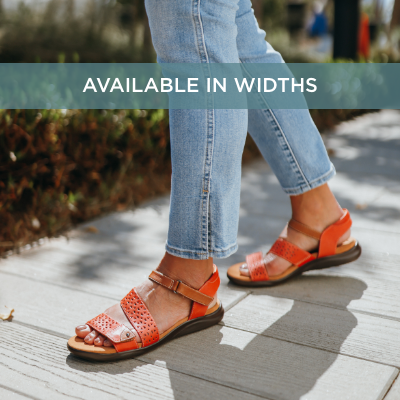 Woman standing on sidewalk