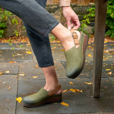 Woman adjusting strap on heel