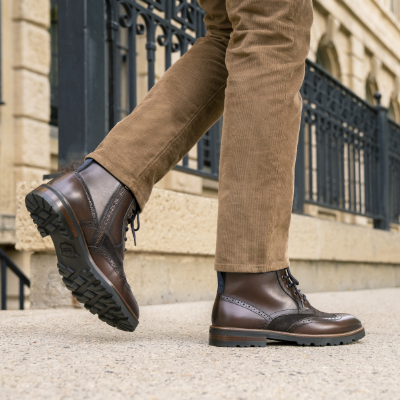 Man standing on sidewalk