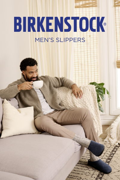 Man drinking coffee on couch