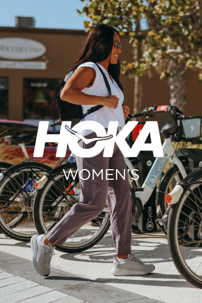 Woman walking to use city bike