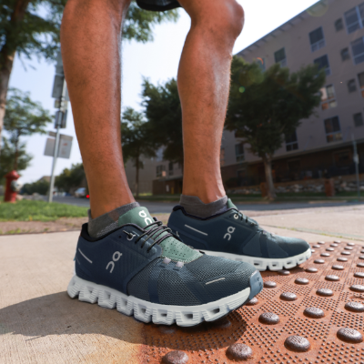 Man standing on sidewalk