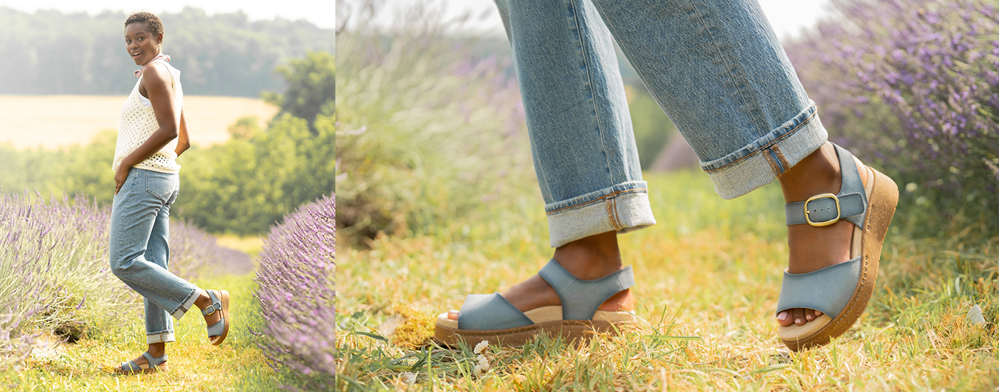 Dansko Bianca Woman standing in a lavender field wearing blue Dansko Bianca sandals