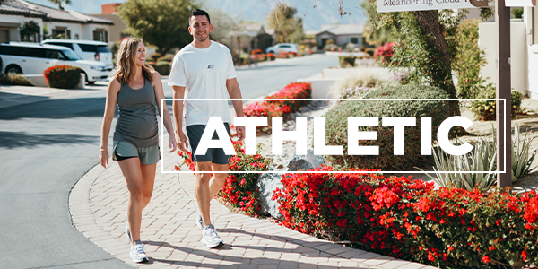 couple wearing athletic footwear walking