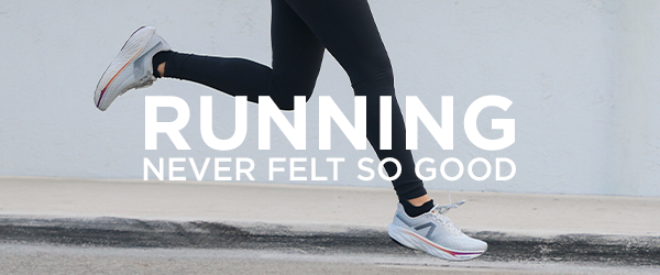 Woman running on sidewalk wearing New Balance 1080 v14 running shoes