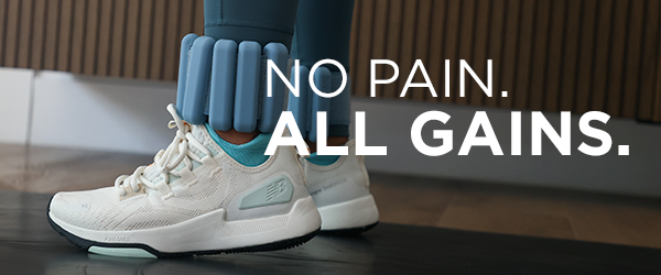 Woman working out in fitness studio wearing New Balance shoes