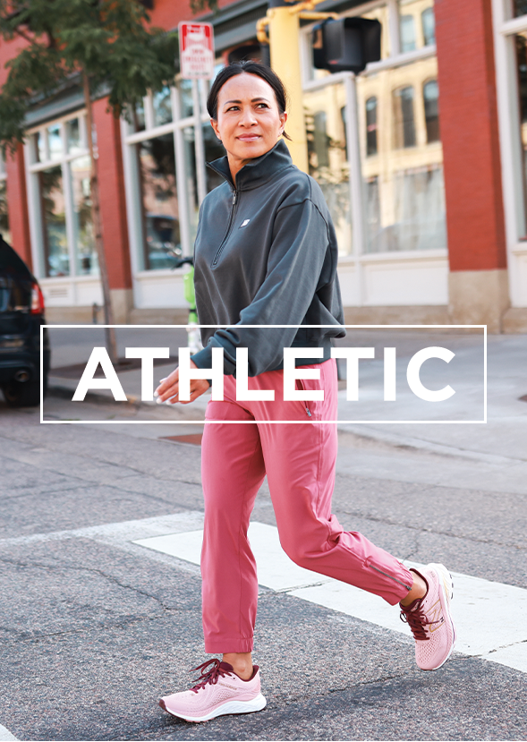 woman walking down street wearing athletic shoes