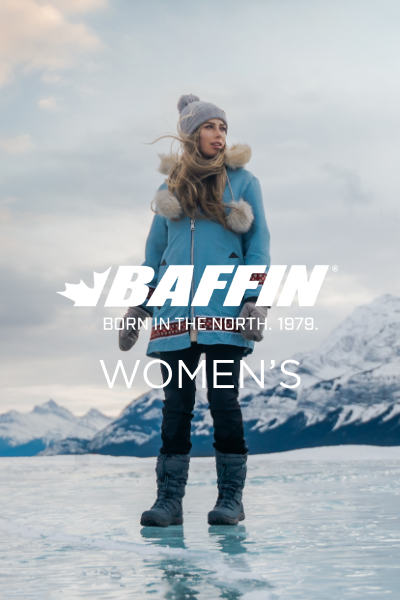 Woman standing on iced over lake