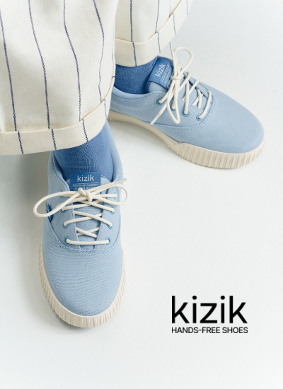 Woman wearing Kizik sneakers in studio