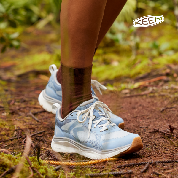 Woman wearing Keen shoes on trail