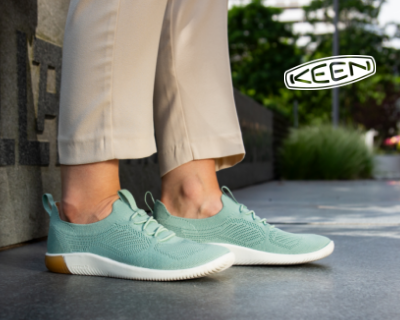 Woman sitting on bench wearing Keen sneakers 
