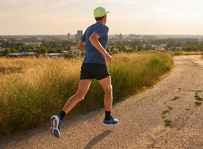 Man running outdoors in Brooks Glycerin running shoes
