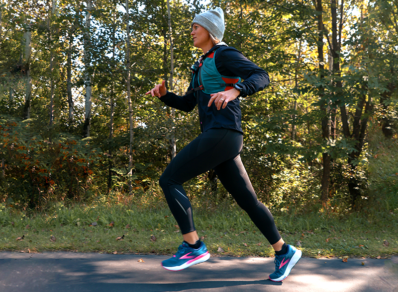 Woman running outdoors in Brooks Ghost 16 running shoes