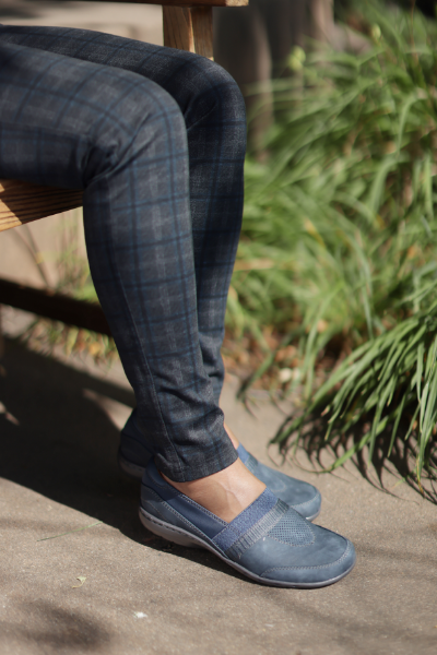 Woman sitting on bench in Cobb Hill shoes 