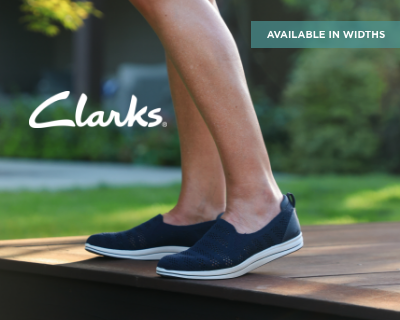 Woman standing on porch in Clarks casual shoes