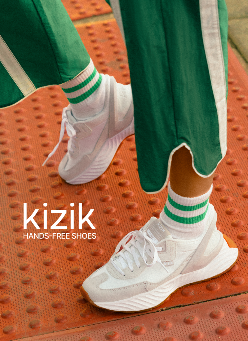 Woman standing on crosswalk wearing Kizik sneakers