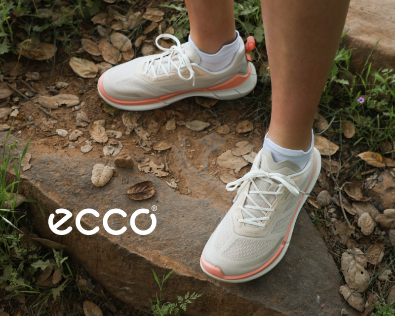 Woman wearing Ecco sneakers on nature path
