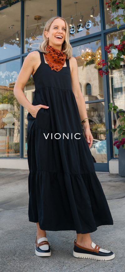 Woman wearing Vionic shoes on sidewalk