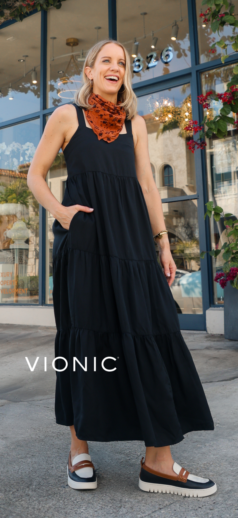 Woman standing on sidewalk in Vionic loafers