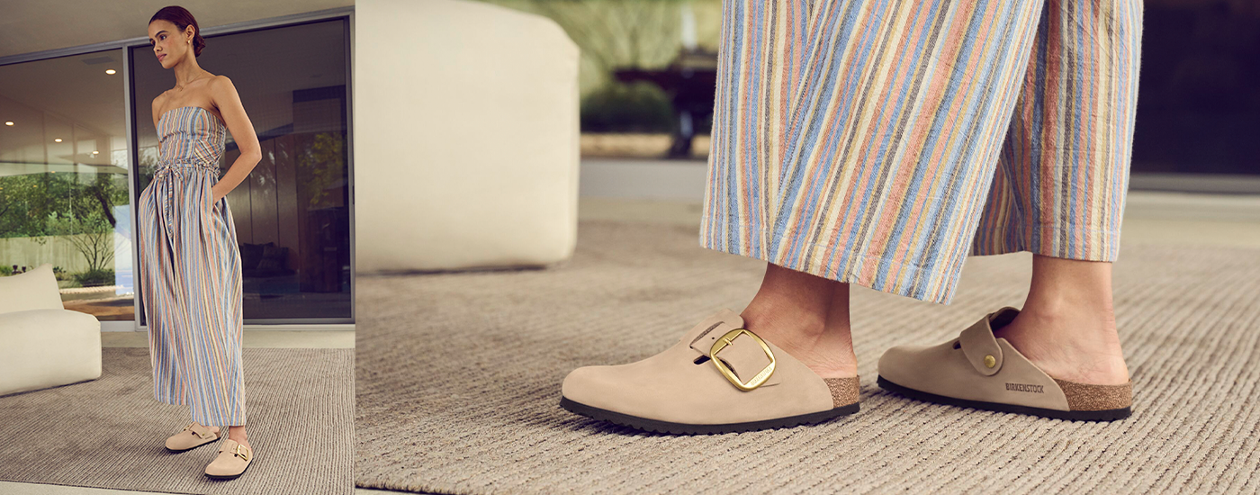 Birkenstock Boston Big Buckle Woman wearing a striped jumpsuit and Birkenstock Boston Big Buckle clogs