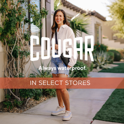 Woman standing in front of house