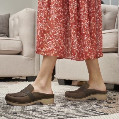 Woman standing in living room 