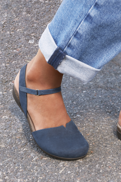 Woman posing foot on driveway