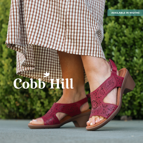 Woman standing on sidewalk in Cobb Hill sandals