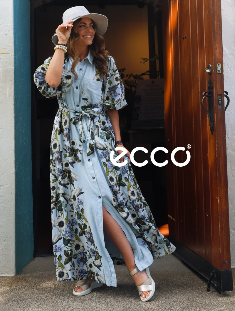 Woman standing in doorway in Ecco sandals