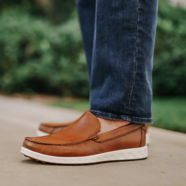 Man standing on sidewalk