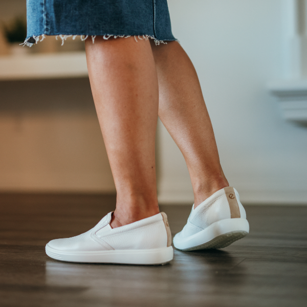 Woman standing on hardwood floors