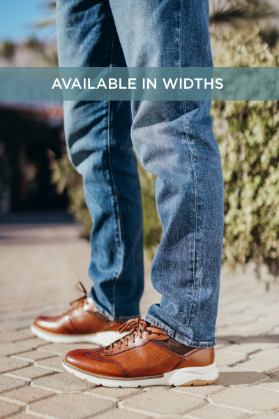 Man standing on sidewalk