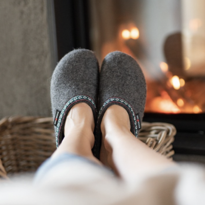Woman resting her feet on basket