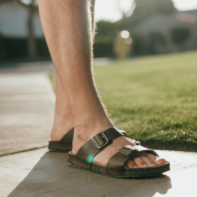 Man standing on sidewalk