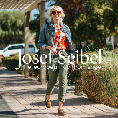 Woman walking on sidewalk
