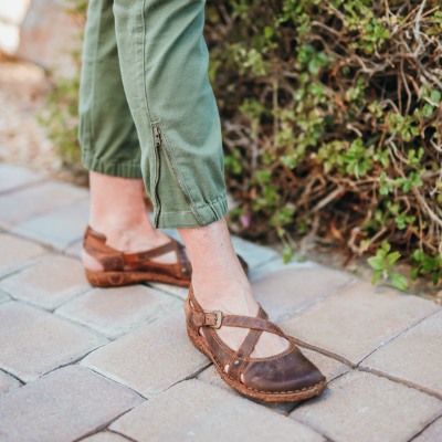 Woman standing on sidewalk