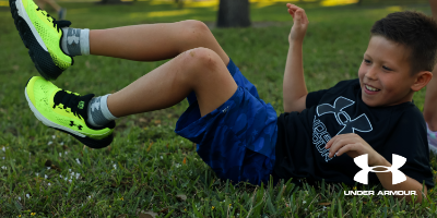 Kid wearing Under Armour sneakers