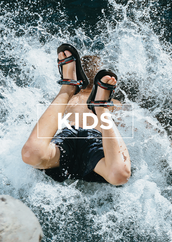 kid wearing sandals jumping into water