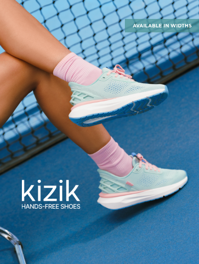 Woman sitting on tennis court wearing Kizik sneakers