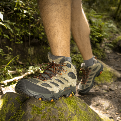 Man stepping up on rocks 